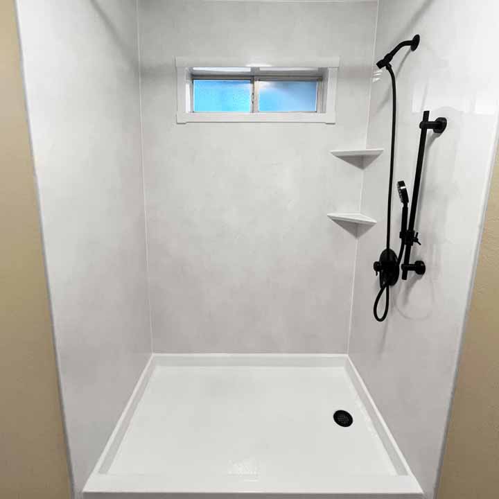 After - White walled clean walk-in shower